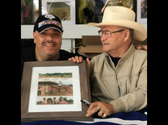 “Ron Turcotte jockey of Secretariat signs a picture of Big Red for Pick 6 King Jonathan Stettin